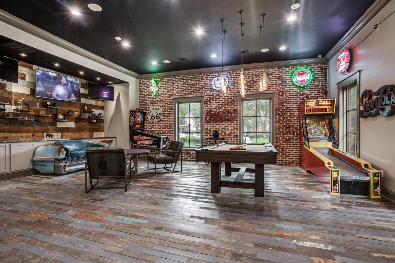 Large, expansive game room with multiple arcade and bar games in Irving, Texas.