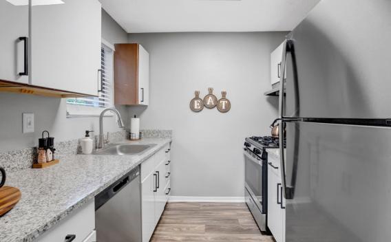 Contemporary kitchen with stainless steel appliances, granite countertops, and elegant cabinetry.