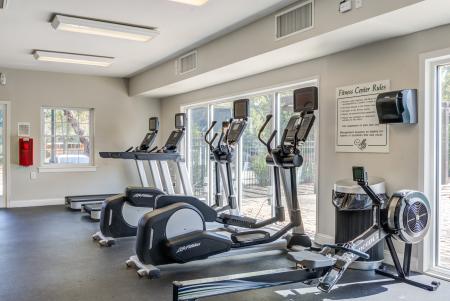 Fully equipped fitness center featuring cardio machines, free weights, and training equipment for a healthy lifestyle.