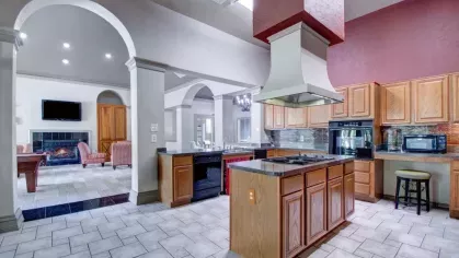 A fully equipped kitchen in the clubhouse with modern appliances and ample counter space.