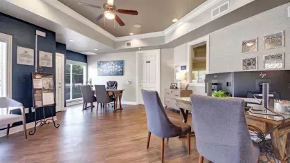 A stylish office space with elegant seating, hardwood floors, and modern decor.