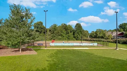 A spacious, fenced-in bark park labeled "200 Braehill Bark Park," perfect for pet activities.
