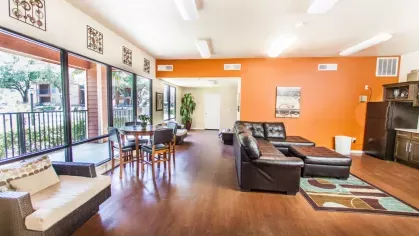 Another lounge area with comfortable seating, bright windows, and a contemporary design aesthetic.