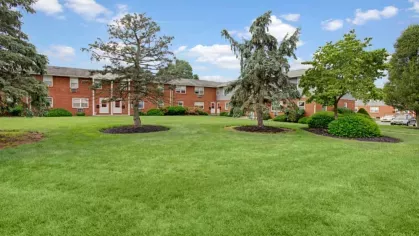 A focus on vibrant greenery and mature trees within tenants’ courtyard at Evergreen Village.