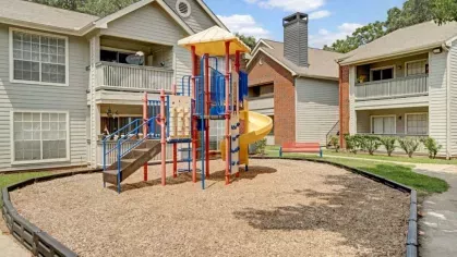 Pool area illuminated by warm sunset hues, highlighting the tranquil water and comfortable seating.
