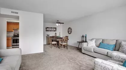 Another angle of the living room with a clear view of the dining space in the background.