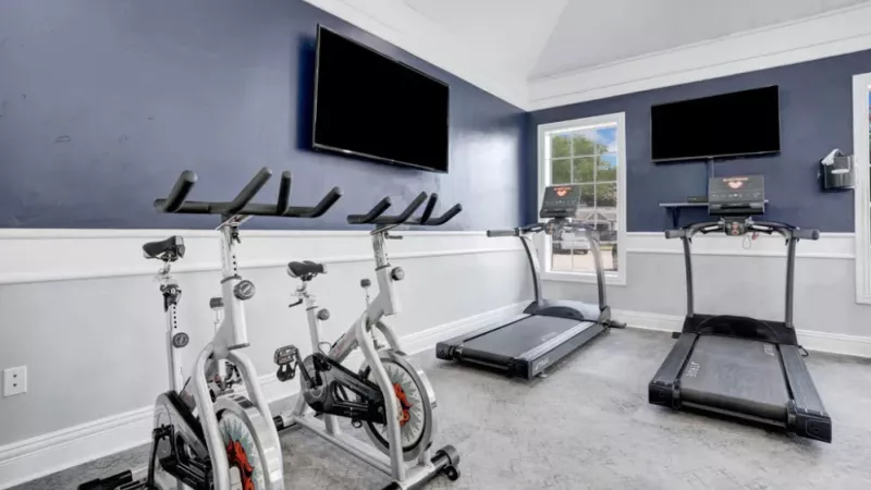 A separate area in the gym featuring stationary bikes and additional exercise equipment for cardio workouts.