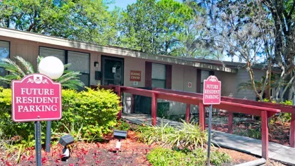 Image 1: A leasing center at an apartment complex, with "Future Resident Parking" signs and a well-kept outdoor space, showing a welcoming entrance.