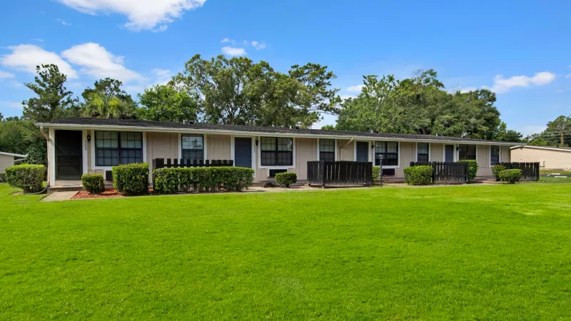 Well-maintained homes with neatly trimmed hedges and spacious front yards.