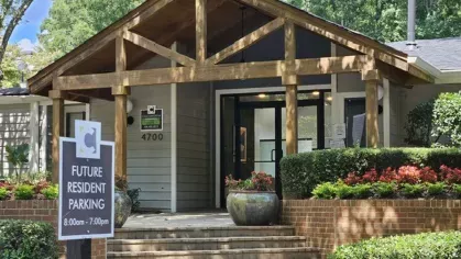 The beautifully landscaped entrance of Chatsworth Apartments in Chamblee, GA, featuring a modern, welcoming design and clear signage for future residents.