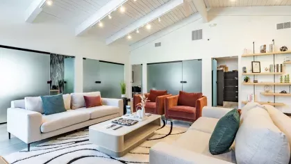 Bright and modern lounge area at Chatsworth Apartments with comfortable sofas and contemporary decor.