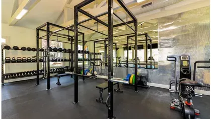 Advanced weightlifting and training equipment in the fitness center at Chatsworth Apartments.