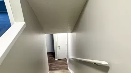 An open-concept living area with ample natural light, neutral tones, and a welcoming ambiance, ideal for comfortable living.