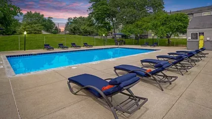 Poolside retreat at Rosehill Plaza with lounge chairs and a serene ambiance.