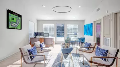 A modern and welcoming leasing office at The Maxwell Apartments, featuring comfortable seating, contemporary decor, and natural lighting.