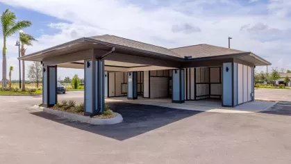 "Covered mail center with secure parcel lockers at Tropia Wellen Park Apartments."
