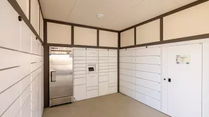 "Covered mail center with secure parcel lockers at Tropia Wellen Park Apartments."