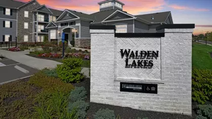The welcoming front entrance of Walden Lakes, highlighted by the property’s beautifully landscaped surroundings and signage.