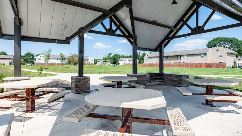 "Picnic pavilion at Worthington Meadows Apartments with covered seating and open views of the surrounding community."