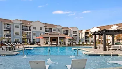 Resort-style pool with a sun deck.