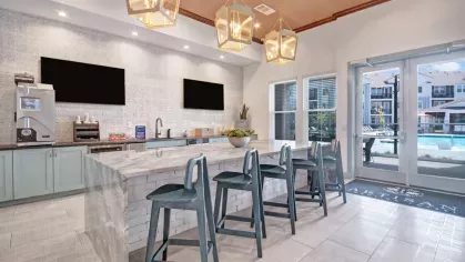 Luxury lounge space with designer furniture, rich wood paneling, and vibrant decor for an upscale ambiance.