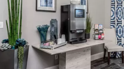Convenient coffee station with modern decor and refreshment options at The Landings of Conroe Luxury Apartments.