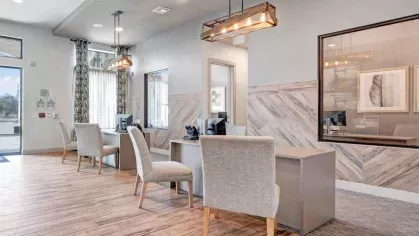 Leasing office at Vista At Town Green, showcasing a bright, welcoming space with elegant decor and modern workstations for a premium resident experience.