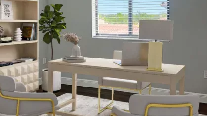 Stylish and inviting home office with a modern white desk, cozy beige chairs, and elegant decor. Natural light streams in through large windows, creating an inspiring workspace.