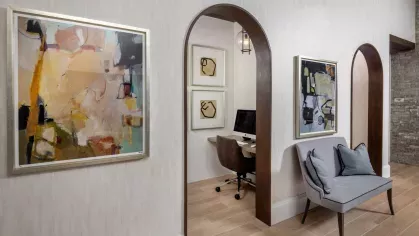 A fully furnished private office space at Locklyn West Palm, offering contemporary decor, a sleek desk, and comfortable seating.