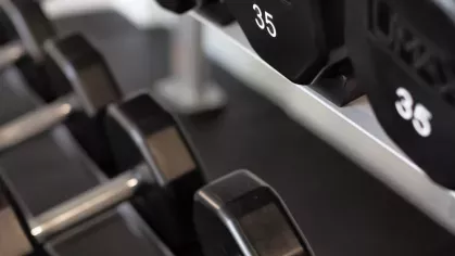 A dedicated space for strength and resistance training with weight racks, stability balls, and resistance bands, ensuring a well-rounded fitness experience.