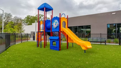 A closer look at the children’s playground, designed with bright slides, climbing bars, and safety flooring, offering a fun and safe space for families.