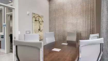 Private conference room with a modern design and seating for productive meetings.