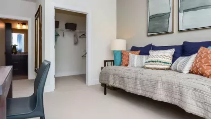 Functional and beautifully designed home office space with ample natural light and modern furnishings at Riverworks Luxury Apartments.