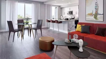 Open-concept living space at The Linden featuring a bright living area with modern furnishings and direct access to the kitchen.