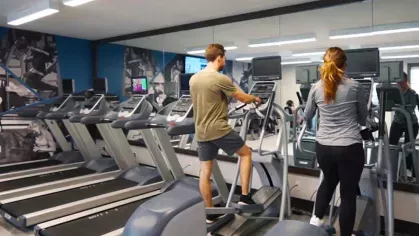 A modern gym with high-end cardio machines, spacious interiors, and a motivating atmosphere.