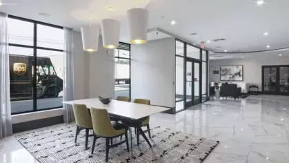 A cozy reading nook with a built-in bookshelf, contemporary decor, and a private study space.