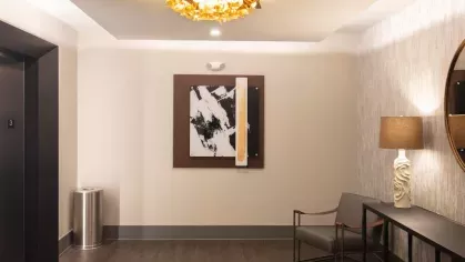 A welcoming seating area with modern artwork, plush furniture