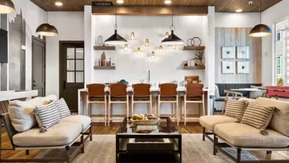  A stylish resident lounge with a gallery wall, contemporary seating, and an open-concept design.