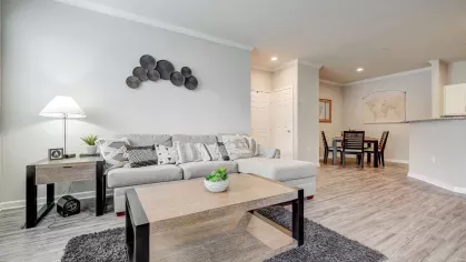 Open living and dining area with stylish decor and durable vinyl flooring at Gates at Citiplace in Baton Rouge, LA