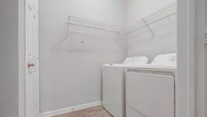 In-unit laundry room with washer and dryer at Gates at Citiplace pet-friendly apartments in Baton Rouge.