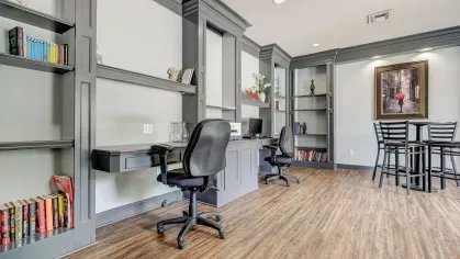 Stylish coworking space with modern desks and shelving inside Gates at Citiplace’s community business center