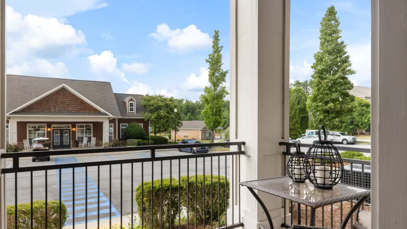 View from a private patio overlooking the leasing office and landscaped grounds at Lauren Ridge.