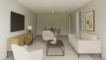 Virtual staging of open-concept living and dining area with sleek furniture, neutral tones, wall-mounted TV, and coordinating artwork at Astorwood Apartments.