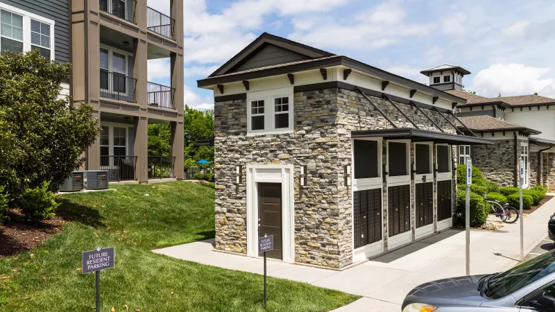 Mail center at Avery at Turkey Creek with stone exterior, mailboxes, and convenient resident access.