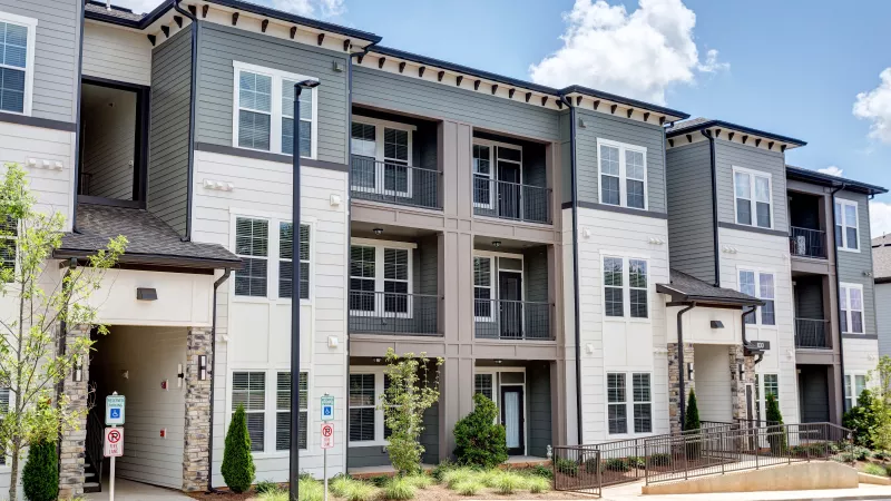 Modern apartment buildings at Avery at Turkey Creek with balconies and handicap accessible entry.