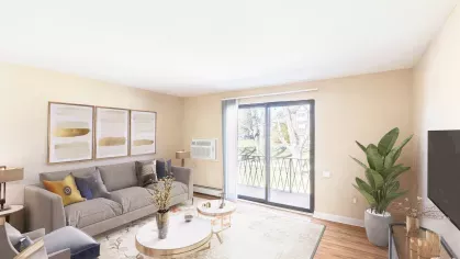 Royal Crest Estates Marlboro living room with sliding glass doors – Bright living room with contemporary furnishings, sliding glass doors, and private balcony views of landscaped grounds.