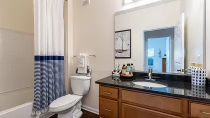 Bright bathroom with shower/tub combination. 