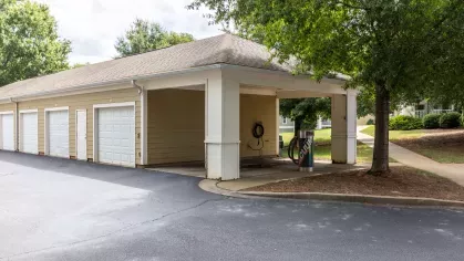 Garages available for residents to rent and covered car washing station with a vacuum and hose to use.