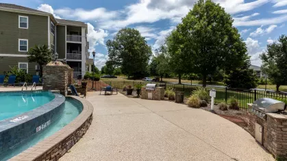 Grilling area conveniently located near the swimming pool. 