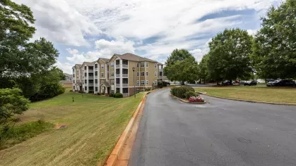 Grandview at Lake Murray entrance, surrounded by lush trees and bright green grass. 